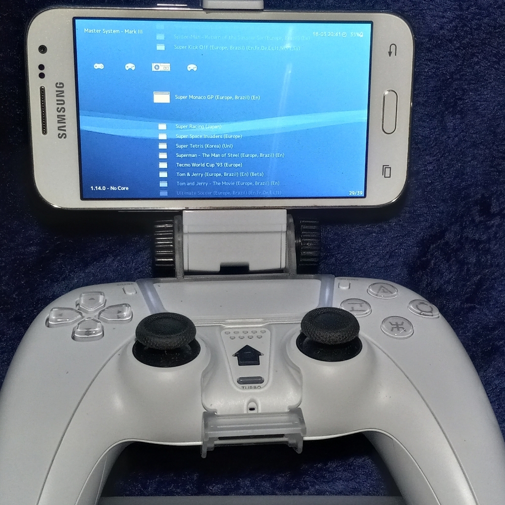 Ps3 games console, Samsung Galaxy smartphone, controller, phone holder